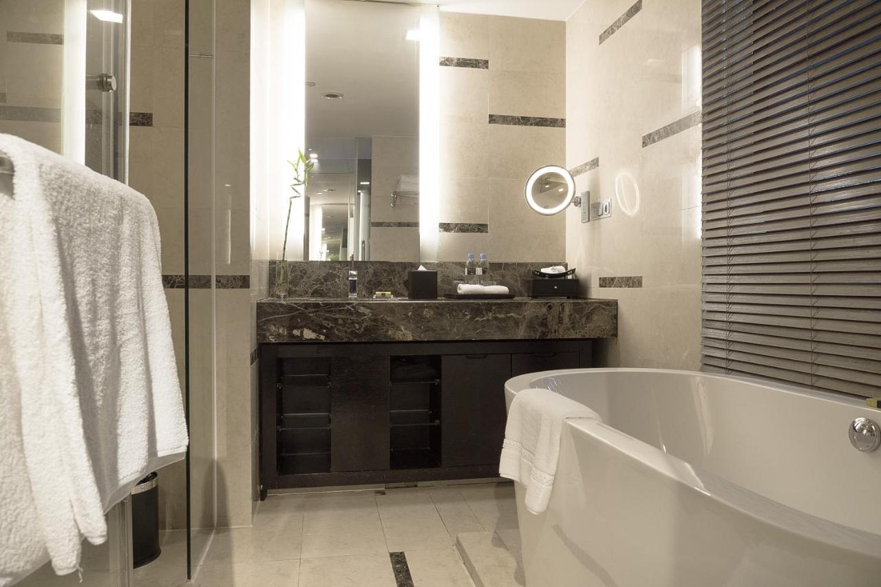 Classic Double Room with Two Double Beds and City View inclusive First Round Mini Bar